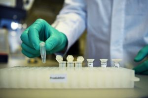 FILE PHOTO: Employee Philipp Hoffmann, of German biopharmaceutical company CureVac, demonstrates research workflow on a vaccine for the coronavirus (COVID 19) disease at a laboratory in Tuebingen
