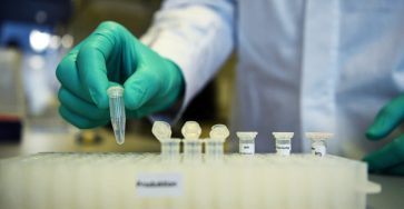 FILE PHOTO: Employee Philipp Hoffmann, of German biopharmaceutical company CureVac, demonstrates research workflow on a vaccine for the coronavirus (COVID 19) disease at a laboratory in Tuebingen